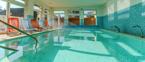 2 indoor pools, open 9:00 AM to 8:00 PM, pool loungers