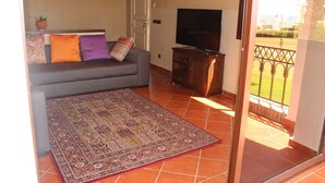 Apartment, 2 Bedrooms | Living area | 60-inch flat-screen TV with satellite channels, TV - Marina de plage (Allyene)