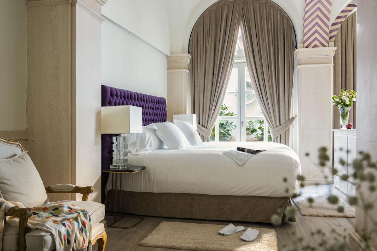 Premium Suite, Courtyard Area | 1 bedroom, Egyptian cotton sheets, premium bedding, down comforters