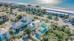 A coastal hotel with multiple buildings, a swimming pool, and a beach view. - Gulf Views with Pool and Sun Deck Space (Destin)