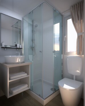 A modern bathroom with a glass-enclosed shower, a white sink, and a toilet. - Victoria mobilehome Istra Premium Camp (Funtana)