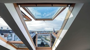 A skylight with a view of the cityscape. - Antrim House Guest Rooms & Suites (Portrush)