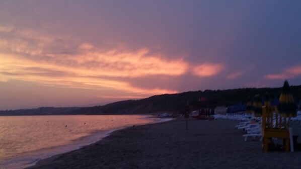 On the beach, sun loungers