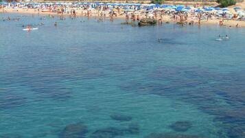 On the beach, sun loungers