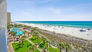 A resort with a pool area, beach, and ocean view. - The Summit 702 (Panama City Beach)