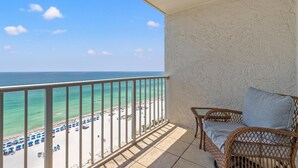A balcony with a view of a beach and ocean. - The Summit 1409 (Panama City Beach)