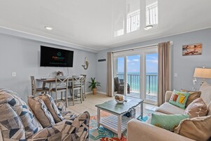 Condo, 1 King Bed with Sofa bed (The Summit 1409) | Living area | Flat-screen TV