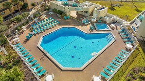 A rooftop pool area with multiple lounge chairs and a smaller pool. - Top Of The Gulf 815 (Panama City Beach)