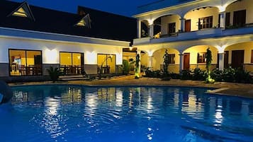 Outdoor pool, open 9:00 AM to 9:00 PM, pool umbrellas