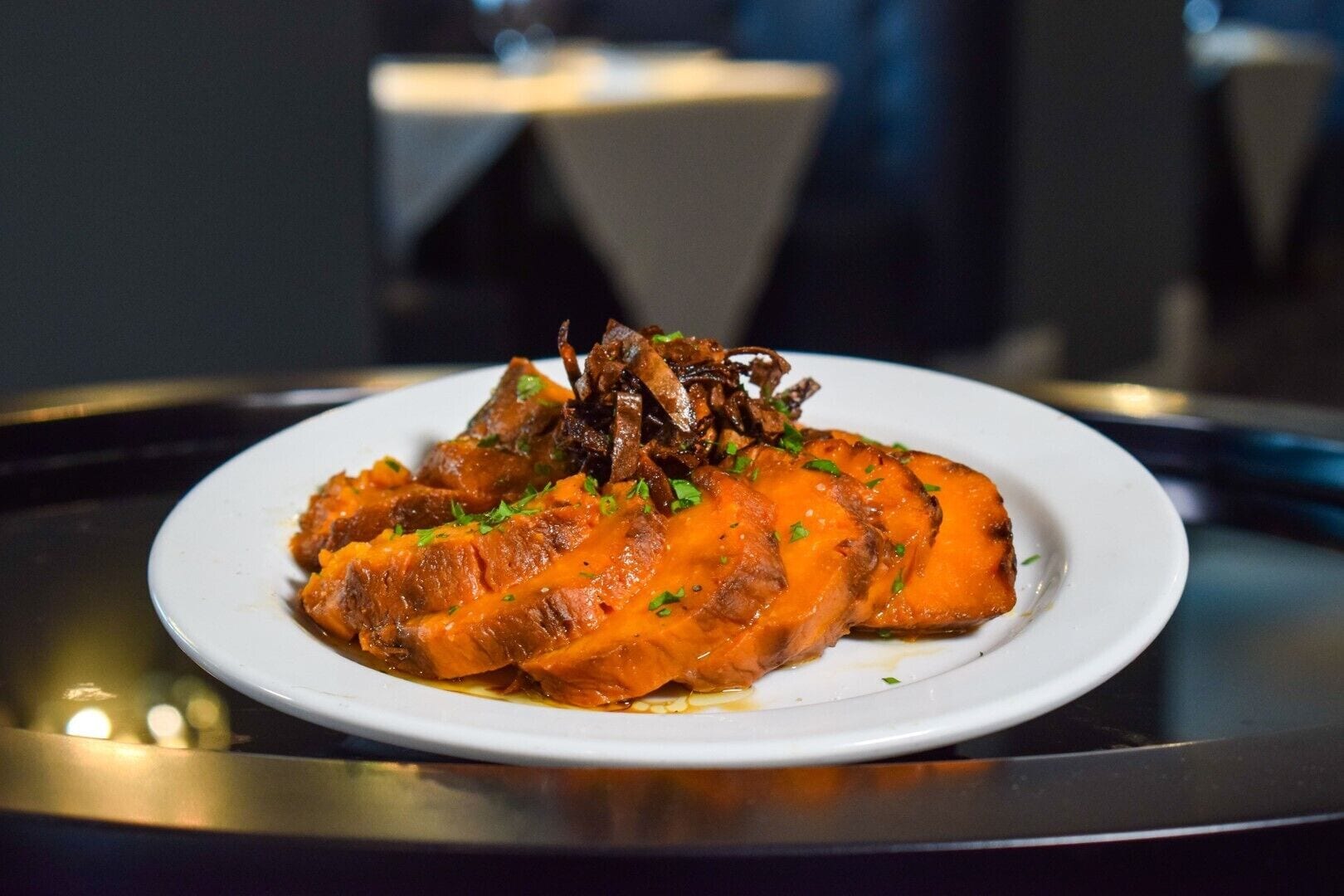 A plate of food with a white plate on a table.