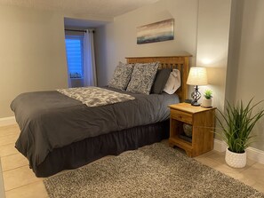 Queen bed in master bedroom