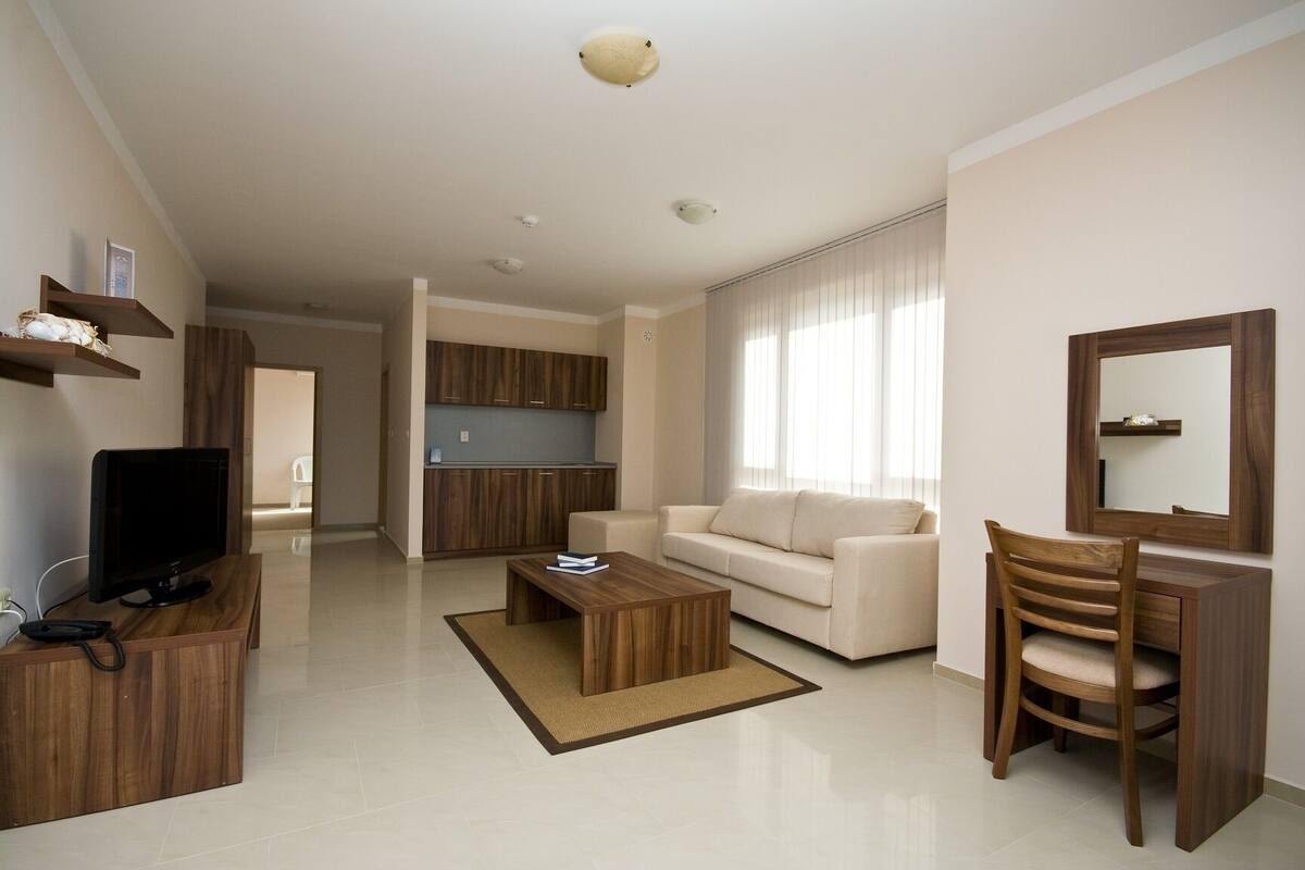 Apartamento, 1 habitación | Zona de estar | Una televisión de pantalla plana