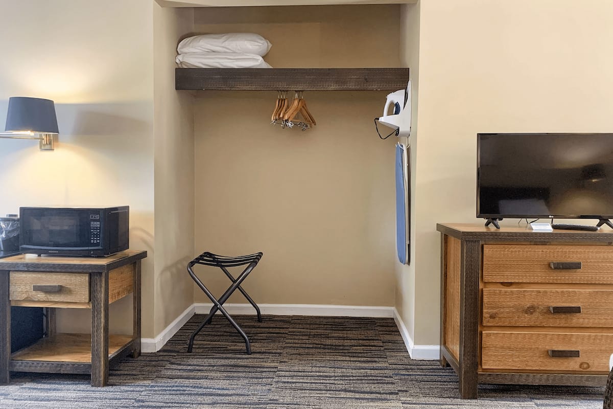 signature room | 1 bedroom, desk, laptop workspace, iron/ironing board