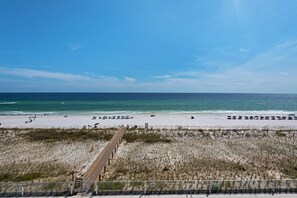 A beach with a wooden boardwalk leading to the shore, sandy beach, and ocean. - Spectacular Gulf Front 4 bedroom/3 bath condo in the newly built Blu complex (Okaloosa Island)