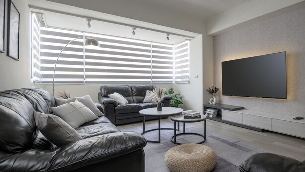 A modern living room with a leather sofa, a coffee table, and a flat-screen TV mounted on the wall. - 2 min to MRT, 4B2b Shopping/Restaurant District (Taipei)