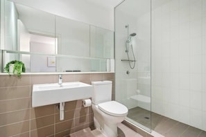 Shower, hair dryer, towels, shampoo