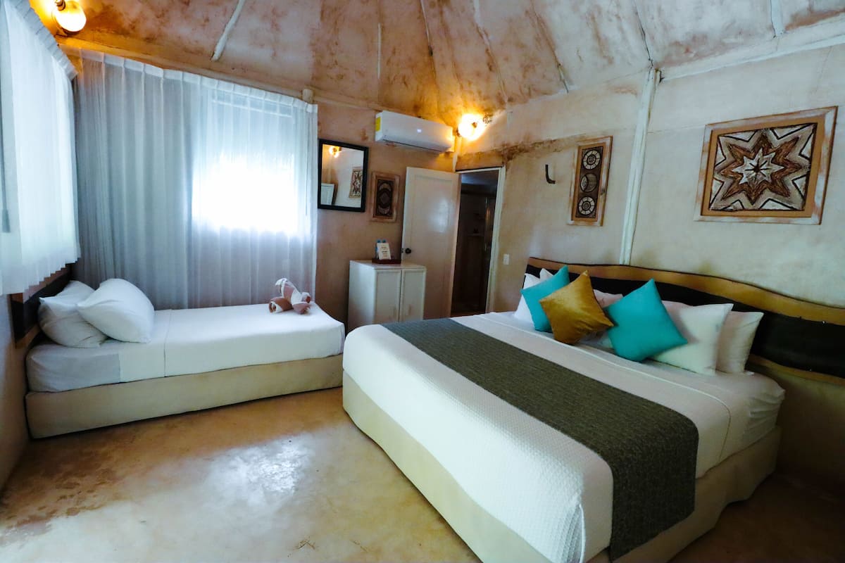 Suite, Pool View | 1 bedroom, minibar, in-room safe, iron/ironing board