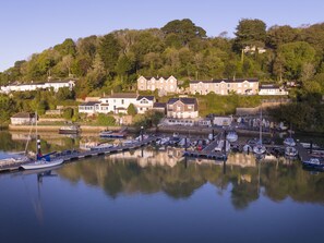 Overlooking a serene harbor, this room offers stunning views of boats and historic buildings.