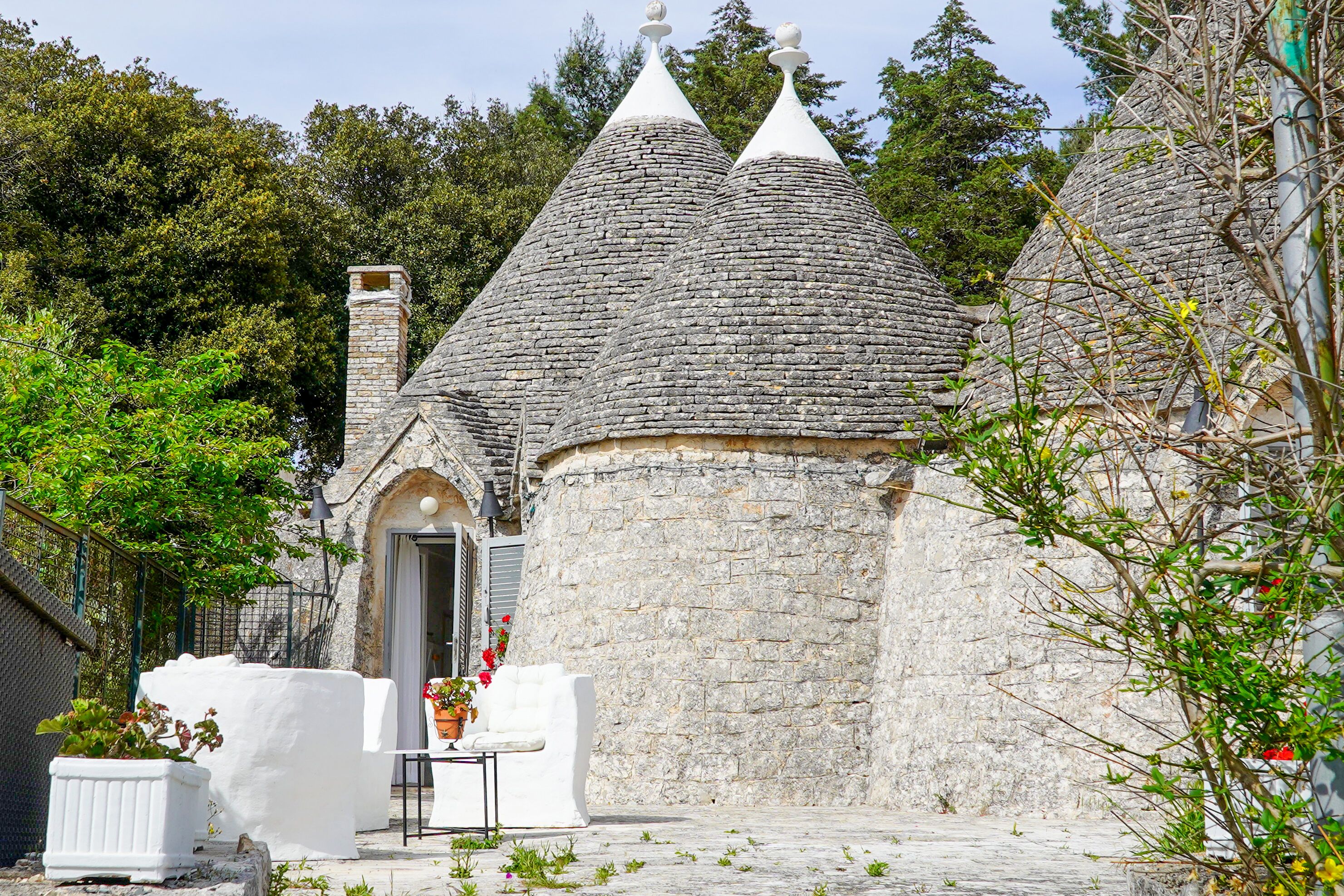 A stone building with a conical roof and a small entrance.