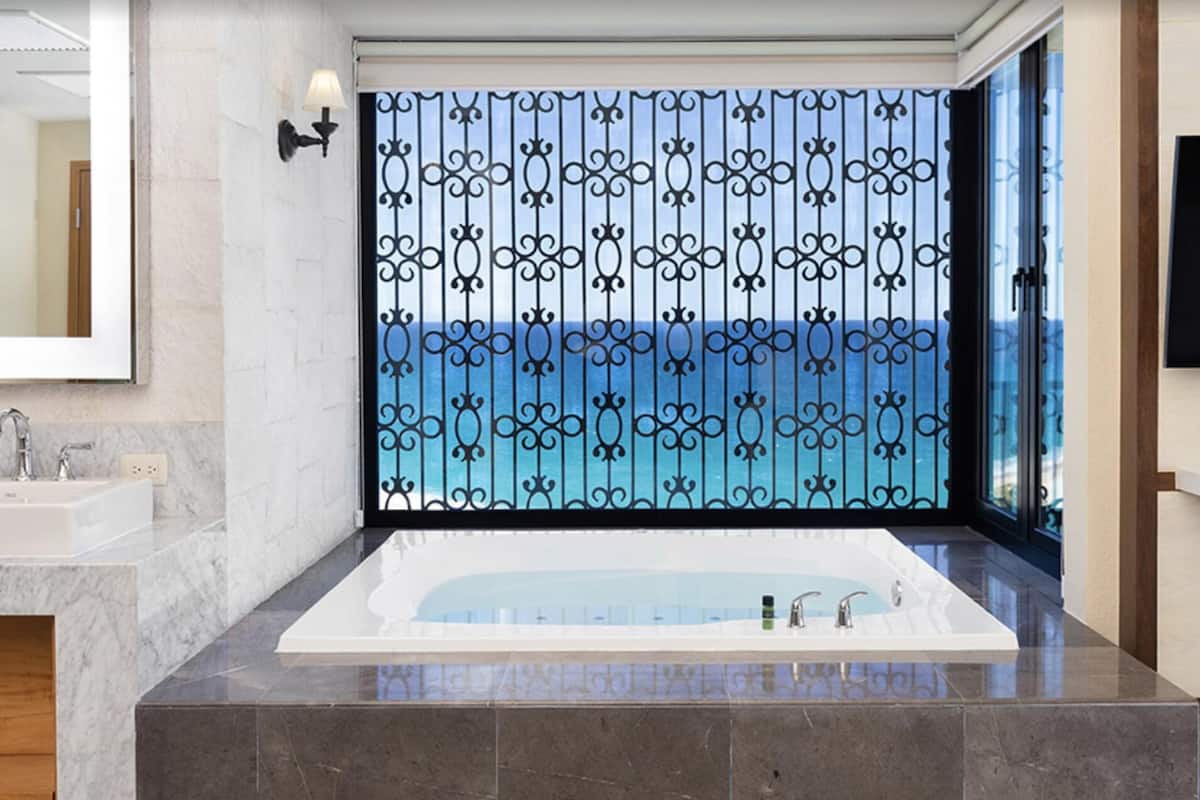 jetted bath, hair dryer, towels, soap