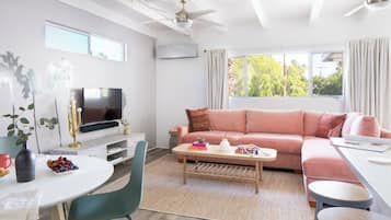 Apartment (Two-Bedroom Apartment) | Living area | 50-inch flat-screen TV with cable channels, TV, Netflix