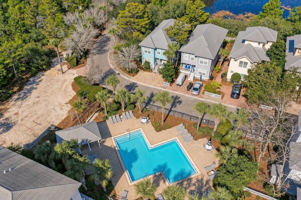 A residential area with a swimming pool, houses, and a sandy beach. - Good Day Sunshine - 4BR/3BA Old Florida Village Home - Sleeps 8 - Community Pool (Santa Rosa Beach)