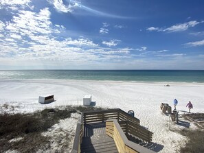 A beach with a wooden boardwalk leading to the water, a sandy beach, and a clear sky. - Good Day Sunshine - 4BR/3BA Old Florida Village Home - Sleeps 8 - Community Pool (Santa Rosa Beach)