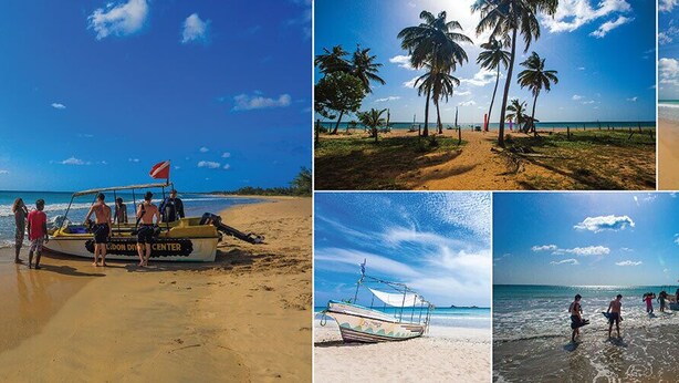 A beach with a boat and people. - JEYs Place (Nilaveli)