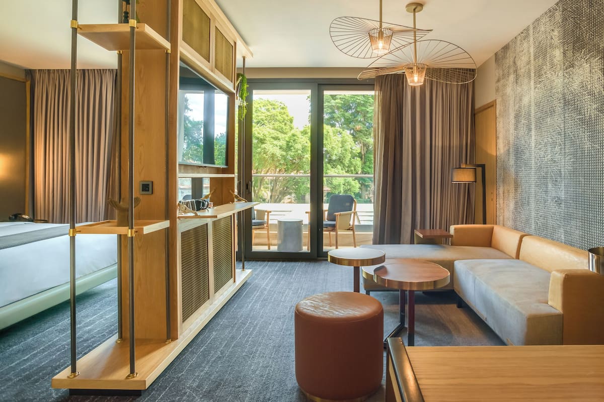 Executive Suite with Balcony | Living area | 55-inch Smart TV with digital channels, TV, Netflix