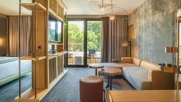 Executive Suite with Balcony | Living area | 55-inch Smart TV with digital channels, TV, Netflix