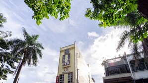 A building with a sign reading "OYO Residence" and a balcony with a railing. - Hotel O Os Residence (Medan)