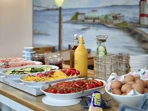 Guests can enjoy a self-service buffet with a variety of fresh fruits, meats, and condiments.