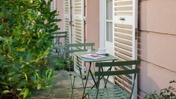 Habitació superior, vistes al jardí | Terrassa o pati