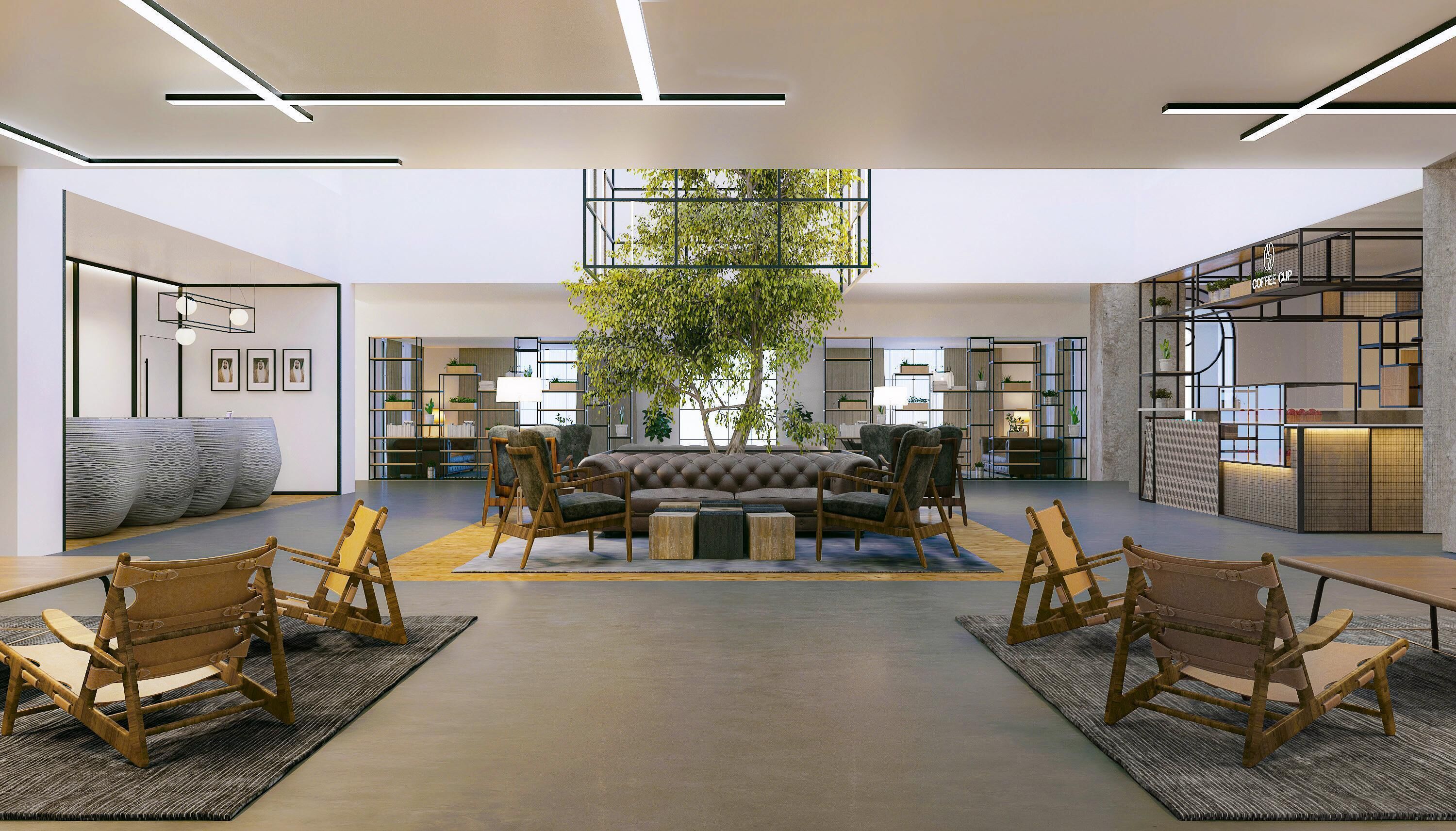 A modern interior with a central seating area, a large tree, and a coffee shop in the background.