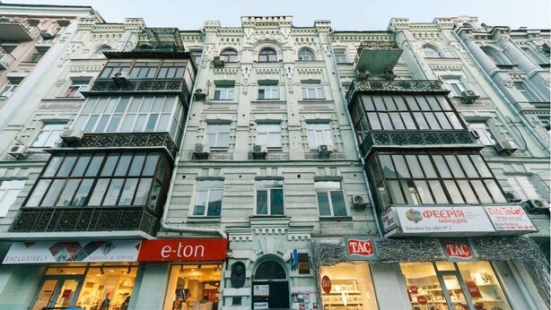 A multi-story building with a classic architectural style, featuring ornate balconies and large windows. - Kyiv Home near Arena Khreschatyk (Kyiv)