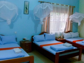 Basic Twin Room | Bed sheets - Naju Guest House Masindi (Masindi)