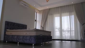Family Apartment | 3 bedrooms, in-room safe, blackout curtains, iron/ironing board