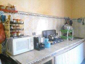 Fridge, microwave, stovetop, cookware/dishes/utensils