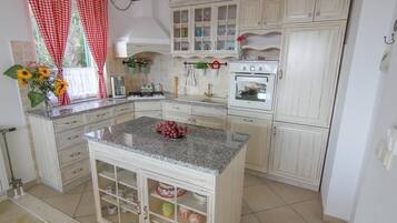 Villa | Private kitchen | Fridge, oven, stovetop, coffee/tea maker