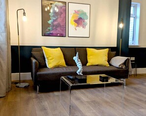 Family Apartment, 4 Bedrooms | Living area | Flat-screen TV