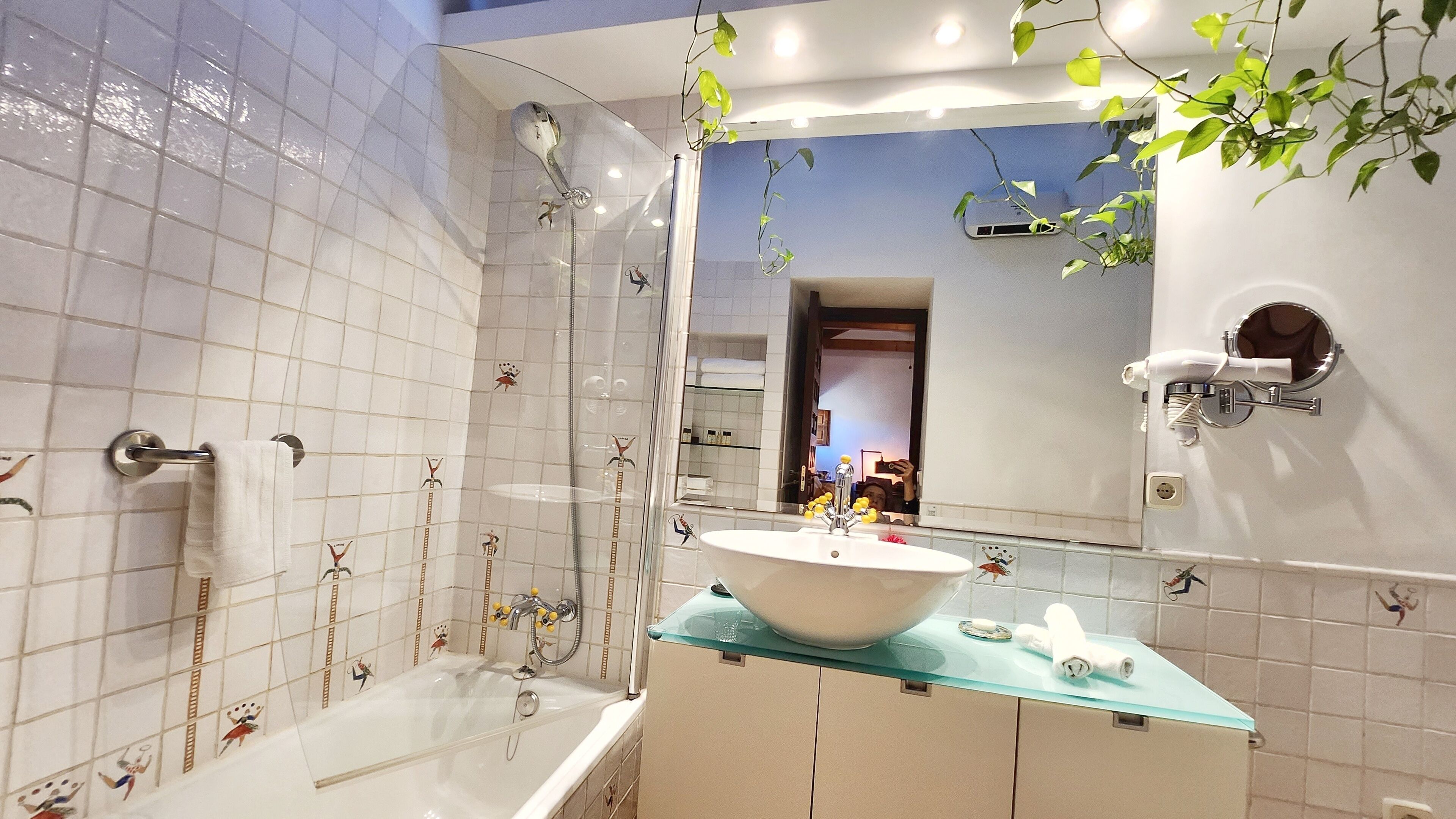 deluxe double room | bathroom | rainfall showerhead, free toiletries, hair dryer, bathrobes