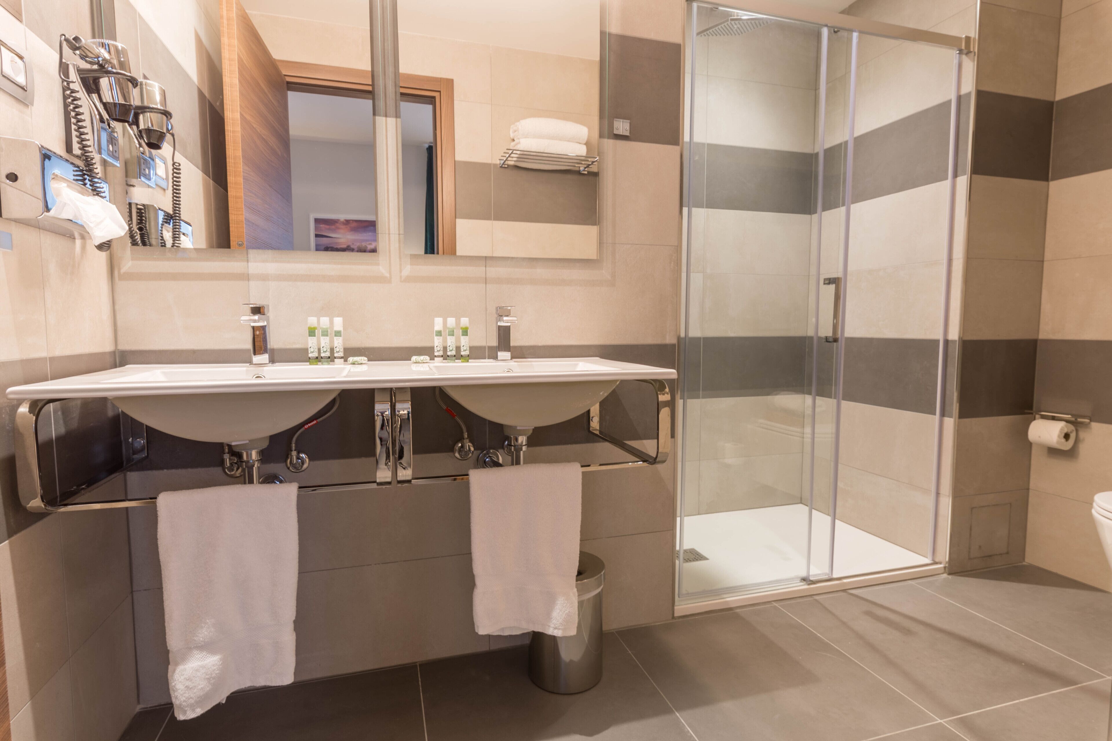 executive twin room | bathroom | shower, rainfall showerhead, designer toiletries, hair dryer