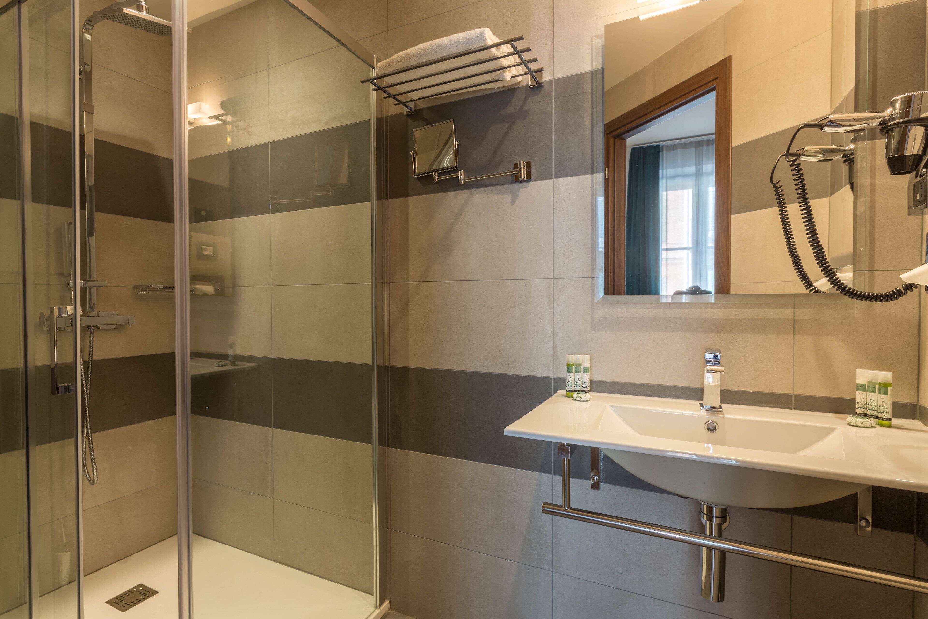 shower, rainfall showerhead, designer toiletries, hair dryer