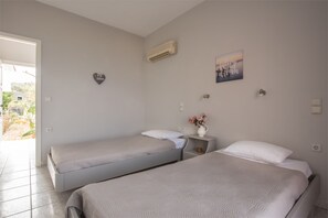 Apartment, 2 Bedrooms, Beachfront | 2 bedrooms, soundproofing, iron/ironing board, free cribs/infant beds