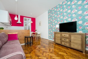 Apartamento luxo | Área de estar | TV de tela plana