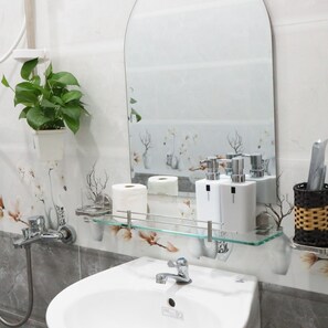 Shower, hair dryer, towels, shampoo