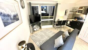 Family Apartment (OB flat 2) | Living area | Flat-screen TV