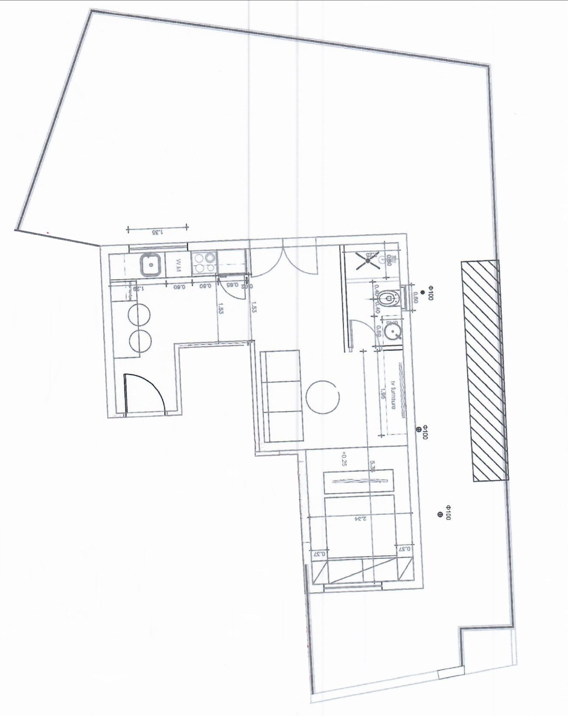 A floor plan of a hotel room with a kitchenette, a bathroom, and a living area.