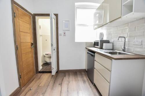 Standard Quadruple Room, Multiple Beds | Private kitchen | Microwave
