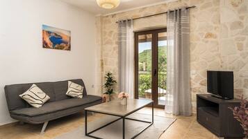 Apartment, 2 Bedrooms (1) | Living area | 20-inch flat-screen TV with cable channels